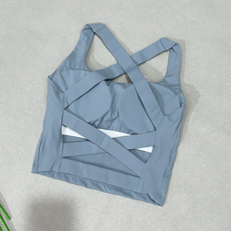 Blue cross back running tank top for women, ideal for workouts with breathable design and sweat-wicking fabric.